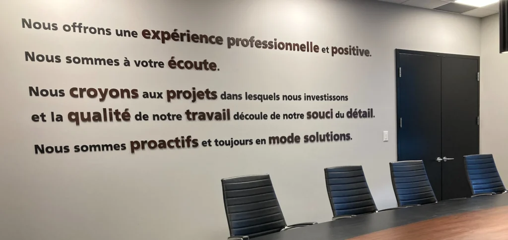 A quote displayed on the wall inside Protech Construction's headquarters, highlighting their commitment to accountability.