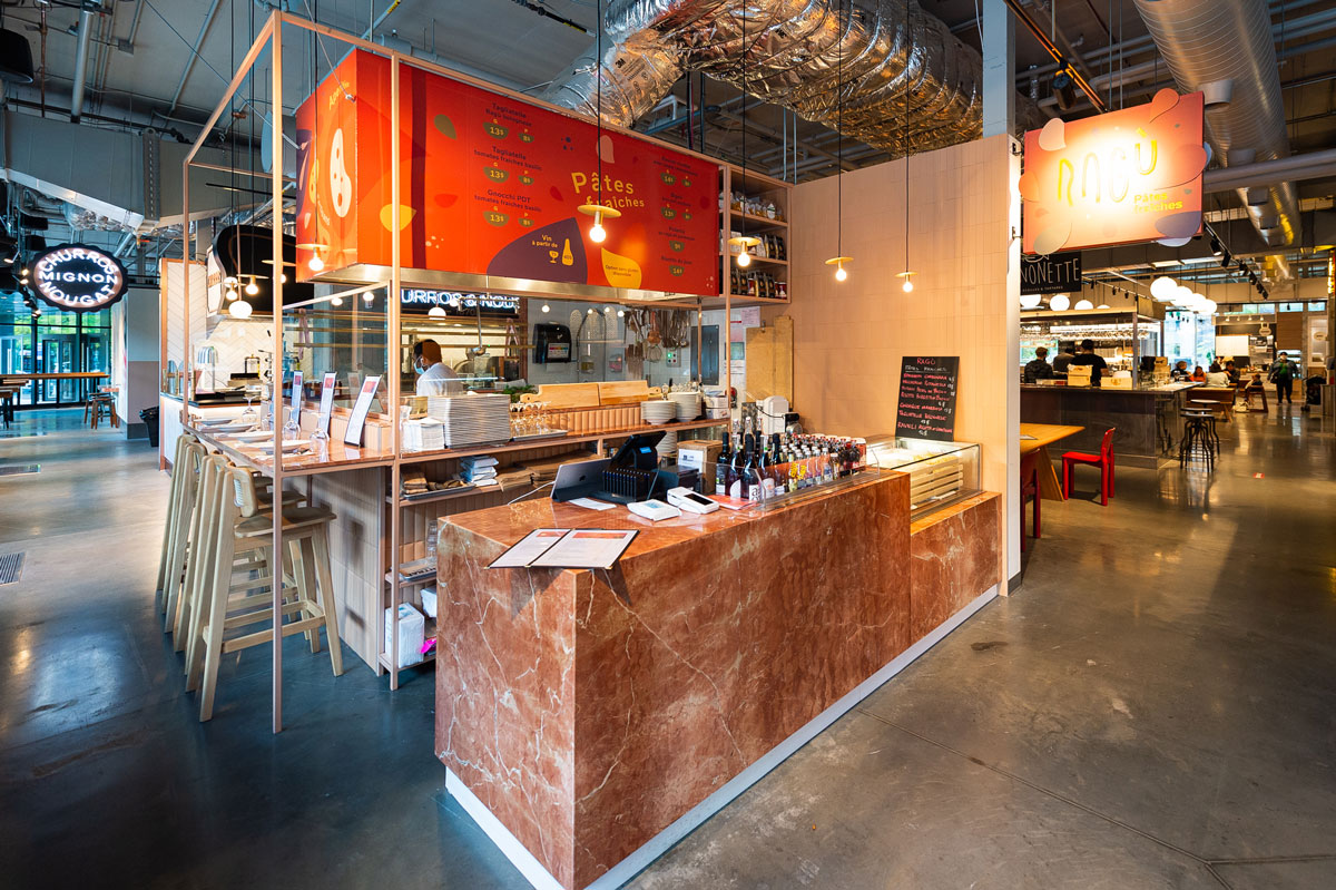 The facade of Ragù Restaurant food stand in Montreal after being transformed by our general contractor and interior designers.